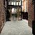 dc557-flagstone-large-ar0amn38-modernist-spire-ar0ms42-stria-volcanic-office-hallway-apr-23-cmyk.jpg